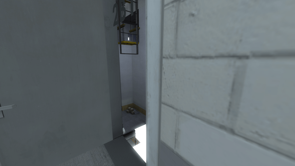 close up on vision through open door 2B1, appears to open onto a void space that allows other rooms to be seen. In this case the floor of the warehouse, a metal gangway and the level above it.